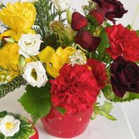 Strawberry · Small floral arrangement in a strawberry shaped jar! Complete with lid to use as a container...