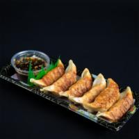 Gyoza* (Seafood) · 6 pcs of seafood pan fried dumpling with gyoza sauce with sesame seeds