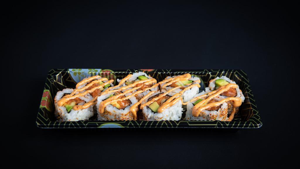 Spicy Salmon Roll · spicy salmon mixed with crunch flakes, avocado, cucumber, shichimi, spicy mayo sauce