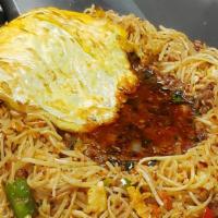 Veg Triple Rice · Vegetarian. Lip-smacking Indo Chinese dish prepared with a combination of noodles, rice, and...