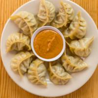 Chicken Steam Momo (10) · Steamed dumplings filled ground veggies or chicken. Served with house made tomato-sesame see...
