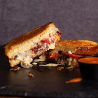Bacon, Love, Tomato (Blt) Grilled Cheese · Sourdough Bread, Bacon, Tomatoes, Muenster & Cheddar Cheese.