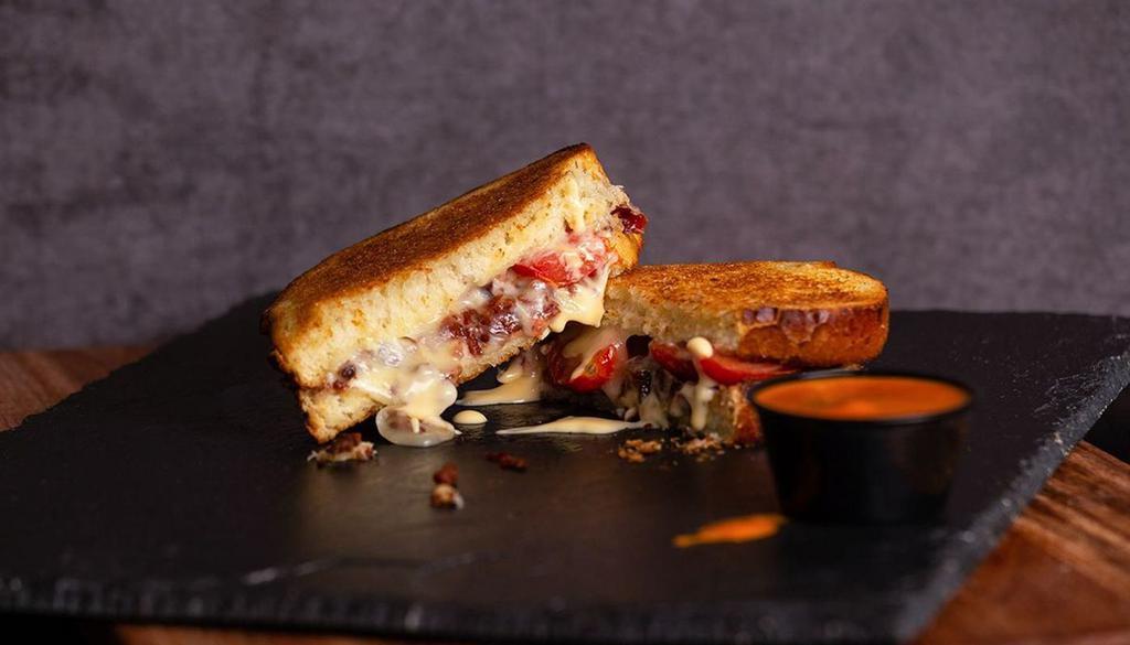 Bacon, Love, Tomato (Blt) Grilled Cheese · Sourdough Bread, Bacon, Tomatoes, Muenster & Cheddar Cheese.