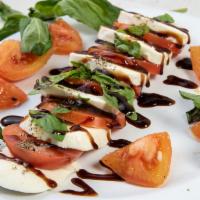 Caprese · Vegetarian. Sliced tomato, fresh mozzarella, aged balsamic, olive oil, and fresh basil.