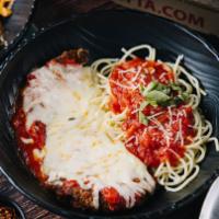 Eggplant Parmigiana · Vegetarian. Hand-breaded eggplant baked in our famous sauce, herbs, and cheese.
