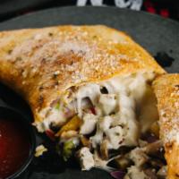 Philly Calzone · Steak or chicken topped with mushrooms, onions, green peppers, and cheese.