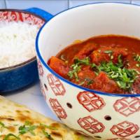Lamb Vindaloo · Boneless lamb and potatoes cooked in a very spicy vinegar onion and tomato sauce.