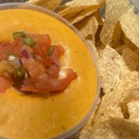 Trap Queso · Fresh homemade queso, comes with pico and jalapeños and tortillas chips for dipping. Grilled...