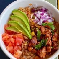 Al Pastor Bowl · Gluten-free. Pineapple-marinated pork over Mexican rice, topped with charro beans, diced tom...