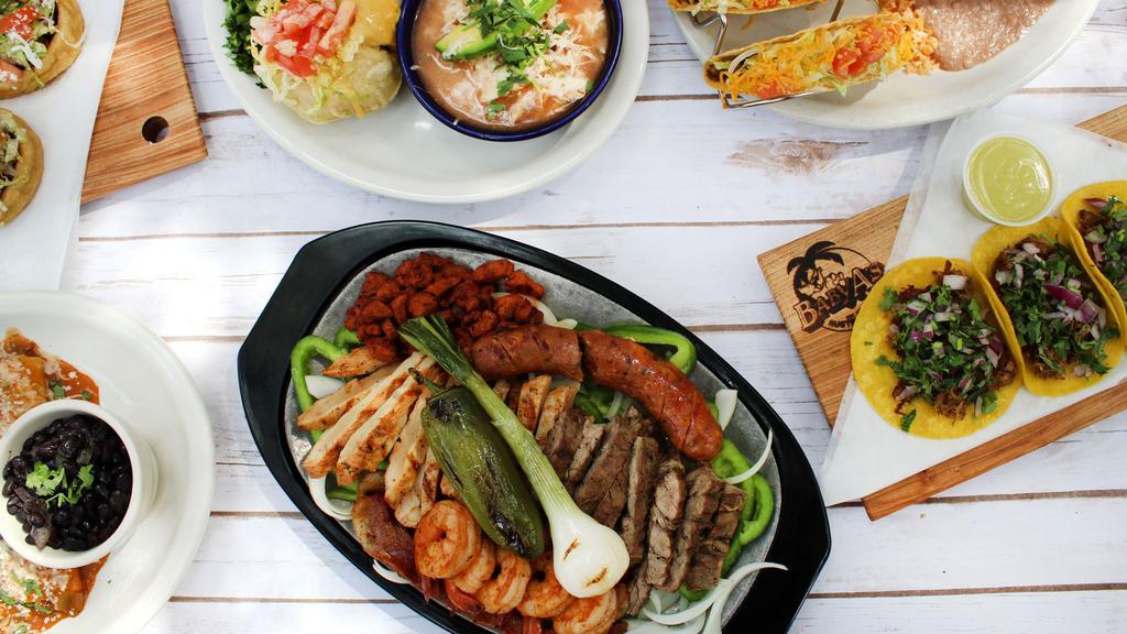 Mixed Grill · Served with both chicken and beef fajitas, a jalapeño-cheddar sausage link, al pastor pork, bacon strips, grilled shrimp and all accompaniments.