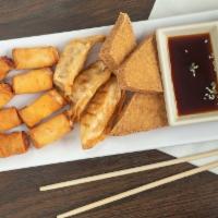 Royal Combination · Cheese rolls (2) Spring rolls (2) Shrimp in a blanket (2) Triangle bean curds (3) and Pot st...