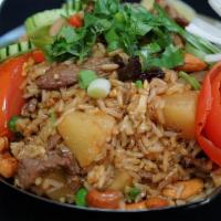 Pineapple Fried Rice · Thai style fried rice with egg, pineapple, raisins, cashew nut, tomato, pea & carrot, and wh...