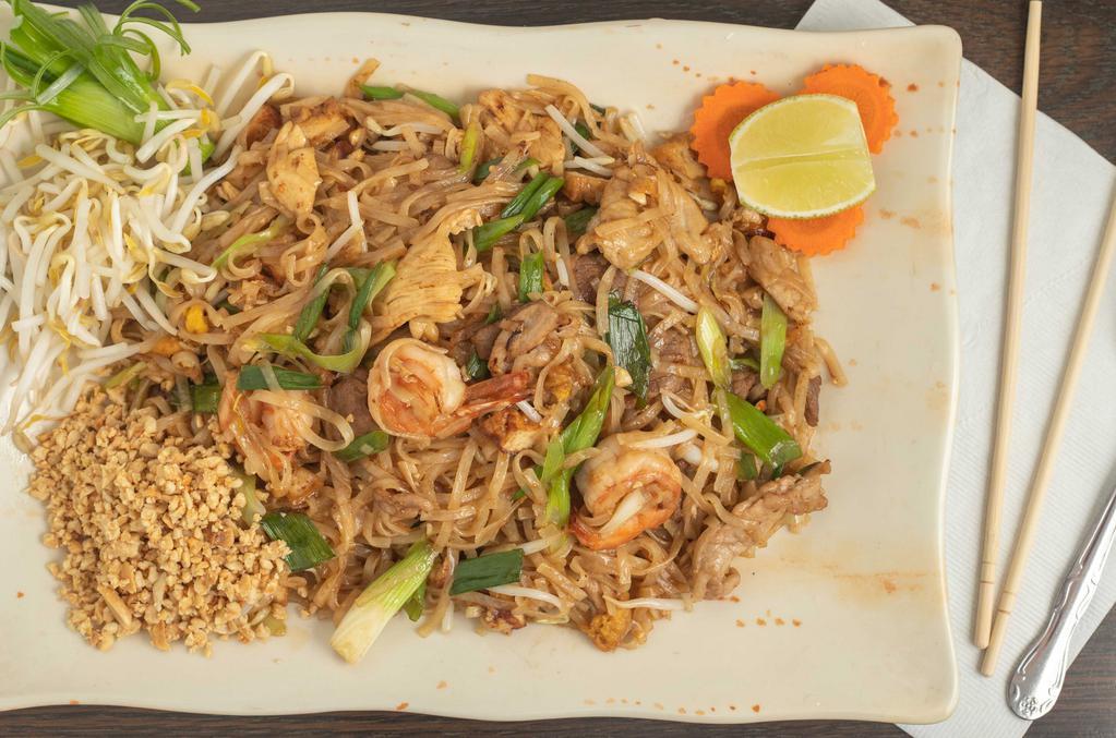 Pad Thai · Stir-fried rice noodles with egg, bean sprouts, green onions, tofu and topped with crushed peanuts with your choice of meat.