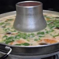 Tom Kha · Choice of chicken or shrimp in coconut milk soup with lemongrass, tomato, lime leaves and
st...