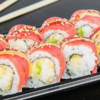 Dallas Roll · Spicy crabmeat, avocado,tempura flake topped with ahi tuna and chef's special sauce.