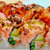 Super Texas Roll · Spicy Crawfish , asparagus avocado inside, topped with seared salmon and spicy garlic mayo b...