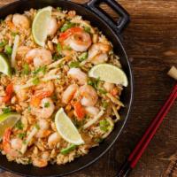 Shrimp Fried Rice · Savory fresh boiled rice tossed in soy sauce and house spices topped with fresh sautéed shri...