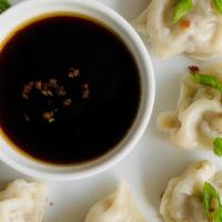 Chicken Dumplings (5) · Steamed or fried served with sesame soy sauce.