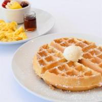 Waffle Combo · A golden waffle served with two eggs any style & choice of side