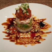 Ahi Tower · Spicy tuna, crabmeat, sushi rice, cucumber, avocado, tobiko with eel sauce, spicy mayo and w...