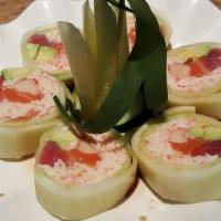 Fantasy Roll · Tuna, salmon, shrimp, crabmeat, crabstick, avocado wrapped in cucumber served with ponzu sau...