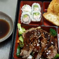 Beef Teriyaki Bento Box · Served with soup salad tempura gyoza and california roll.