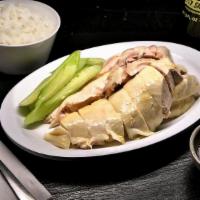 Hainanese Chicken Rice (Half Chicken) · Chicken slowly cook with traditional Hainanese method, served with flavorful oily rice.