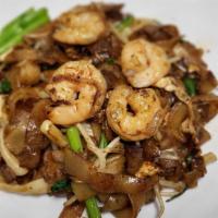 Char Koay Teow · Flat noodle stir-fried with light and dark soy sauce, sambal, seafood and vegetables.