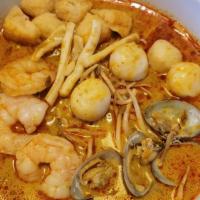 Curry Noodle Soup (Seafood) · Yellow noodle, dried tofu with mixed seafood curry soup.