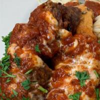 Meatball Parmigana Entree · served with a side of spaghetti
