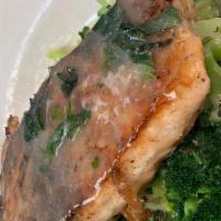 Grilled Salmon · Grilled Fresh Salmon served in lemon butter wine sauce and side of Broccoli