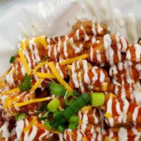 Buffalo Chicken · Crispy homestyle chicken tossed in buffalo sauce and topped with ranch and chives.