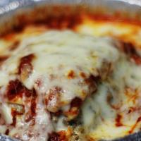 Beef Lasagna · Layers of pasta, beef, and three cheeses topped with tomato sauce.