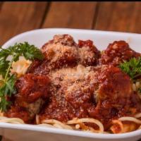Spaghetti & Meatballs · Spaghetti topped with tomato sauce, meatballs, and melted mozzarella cheese.