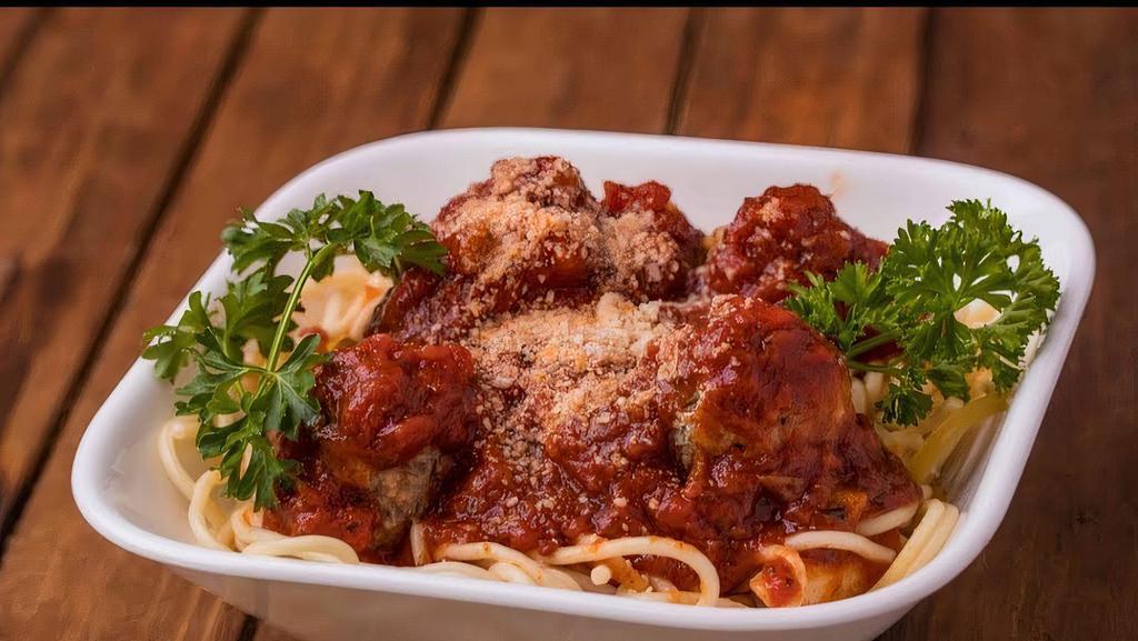 Spaghetti & Meatballs · Spaghetti topped with tomato sauce, meatballs, and melted mozzarella cheese.