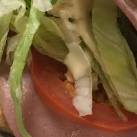 Trio · Turkey, ham, salami, lettuce, tomatoes, onions, mayo, and sauce (is a mixture of mayo, olive...