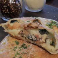 Stromboli Calzone · Pepperoni, Italian sausage, fresh mushrooms, black olives, green bell peppers, all-natural, ...