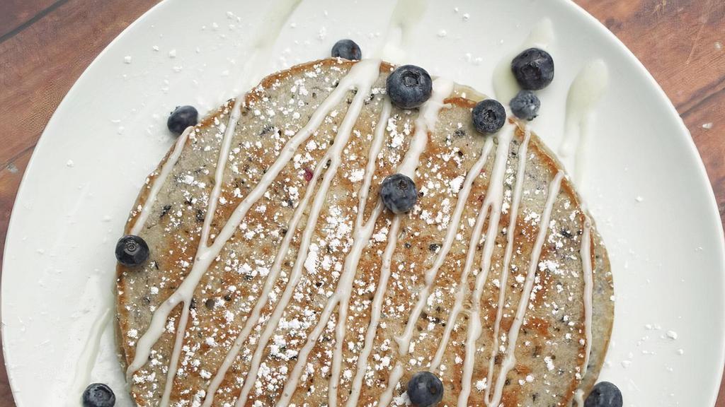 Bangin’ Blueberry Pancakes · 2 decadent Blueberry pancakes topped with powder sugar and butter served with maple syrup