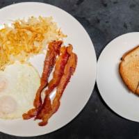 Kids Bacon And Eggs · One egg any style, hash browns, two strips of bacon and one piece of toast