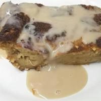 Coconut Bread Pudding · Topped with a rum cream sauce.