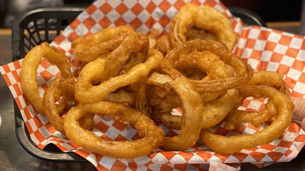 Onion Rings · Beer battered, Crispy onion rings served with ranch or blue cheese for dipping