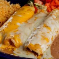 Trio Enchiladas · Three enchiladas (one chicken one beef one cheese) topped with chili gravy and cheese.