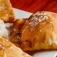 Sopapillas · Light pastries sprinkled with cinnamon and powdered sugar, finished with a drizzle of honey....