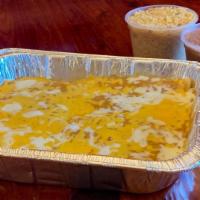 Enchilada Family Pack · 12 Enchiladas of your choice with Mexican Rice and Refried Beans.. Serves 4.