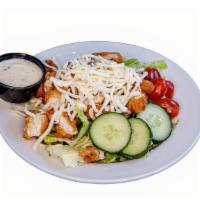 Crispy Chicken Salad · Crispy chicken, romaine lettuce, grape tomatoes, cucumbers, carrots and croutons.