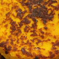 Choc'Lo · Traditional Colombian sweet corn arepa filled with melted cheese.