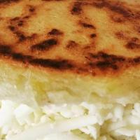 Platano · Semi-sweet plantain arepa with cheese or add shredded beef.
