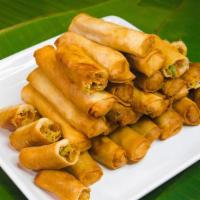 Veggie Lumpia (3 Pieces) · Filipino fried spring rolls wrapped in a thin, pastry-like skin filled with tofu, mixed vege...
