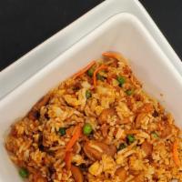 Fil-Bbq Pork Fried Rice · This delicious fried rice is made with Filipino barbeque marinated pork, carrots, peas, and ...