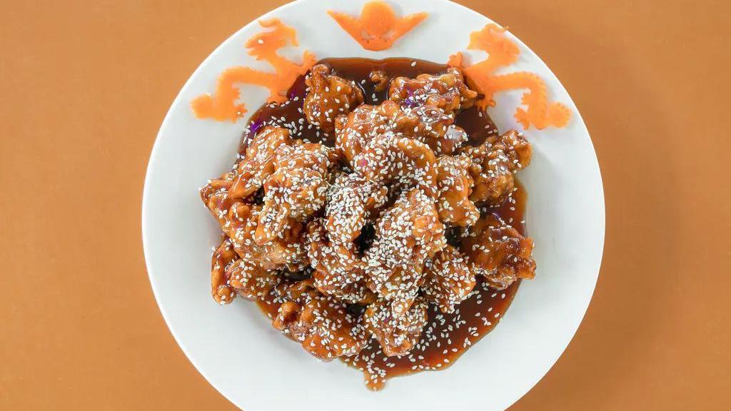 Sesame Chicken · Chunks of chicken quick fried to crispy. stir iried with sesame and special brown sauce. served with fried rice.